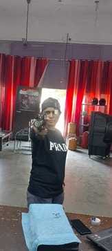 The daughter of a labourer held the rifle and aimed for success