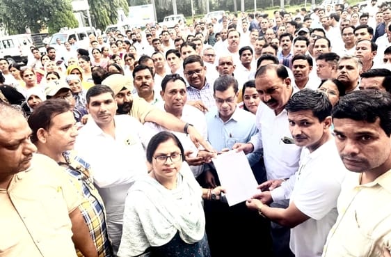 Teachers gathered at DM office in protest against TET mandatory