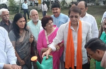 The MP and his wife planted a tree.