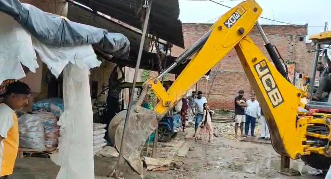 Bulldozer runs on the service lane of Kakwa Overbridge