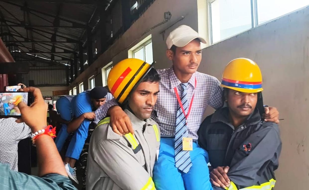 Rescue teams are trying to save the trapped laborers.
