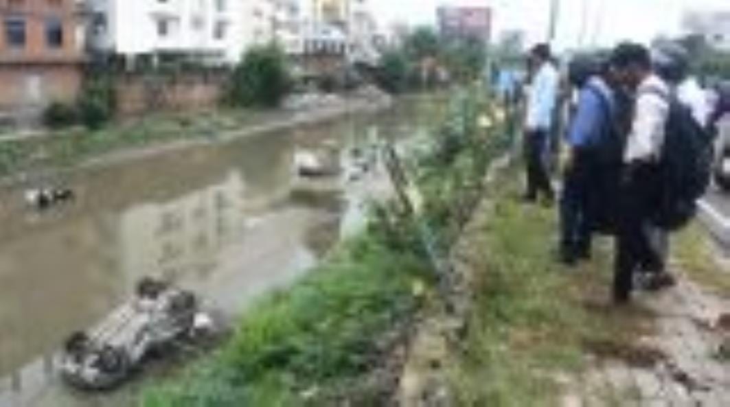 A speeding car plunges 30 feet into a drain, injuring a bank cashier