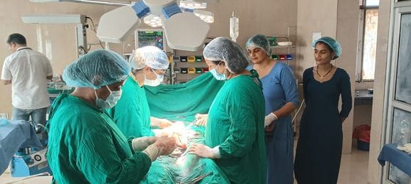 The woman gave birth to two children through a cesarean delivery.