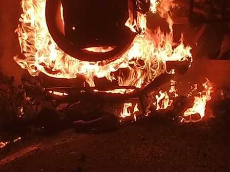 A tractor trolley loaded with straw overturned, and the driver burned alive in the fire.