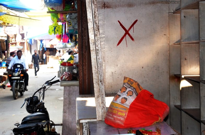 Red marks on illegal constructions obstructing the Durga Temple corridor