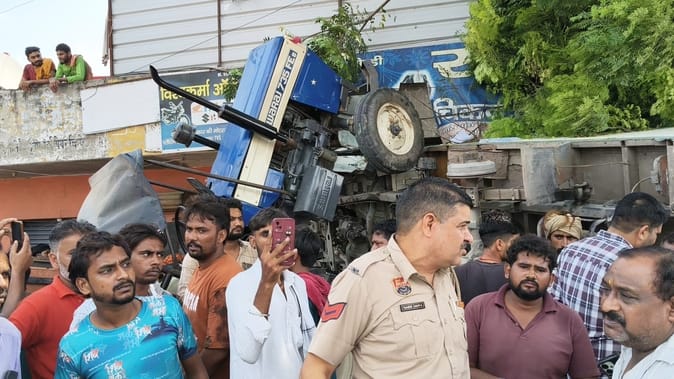 A parked pickup overturned after colliding with a tractor, a major accident was averted.