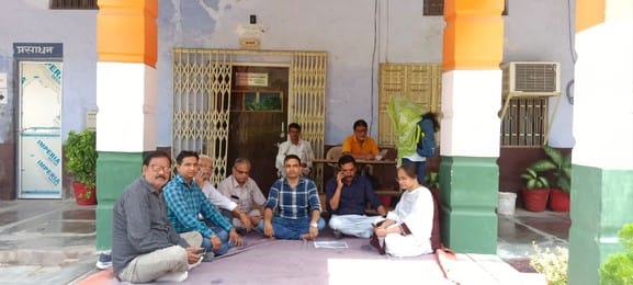 Teachers staged a sit-in protest against the principal's orders.