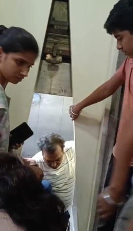 A woman trapped with two children in Panchsheel Primrose for half an hour fainted, sparking uproar.