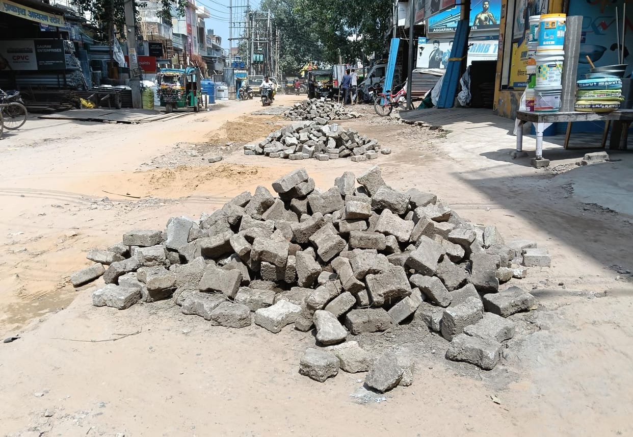 shopkeepers annoyed for old tile used in road repairing