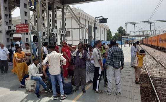 Long waiting times for trains add to the woes of migrants heading home.