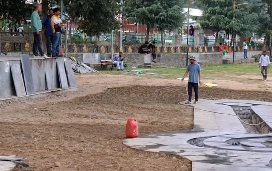 A fountain is being built in Dhalpur using water from the government tap.