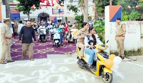 Police negligence... allowed to ride a scooter without helmet in the rally