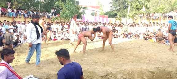 People enjoyed wrestling and Ragini at the Gughal fair.