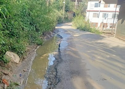 The road in Kotkhai market has become dilapidated due to lack of water drainage.
