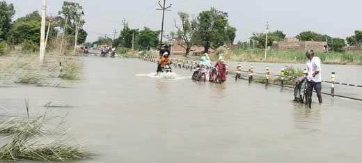 Roads are difficult to walk on due to road cuts and waterlogging