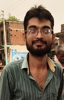The body of a shopkeeper was found hanging from a towel in the garden.
