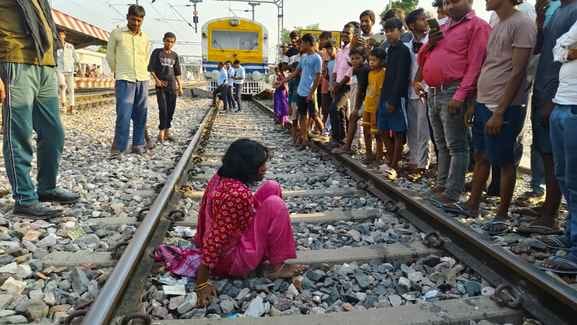 A man and a woman lay on the railway track after a drunken fight