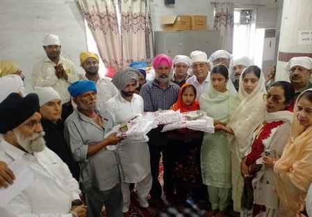 Three Punjab flood-affected families were presented with cash and food items worth Rs 1 lakh each.