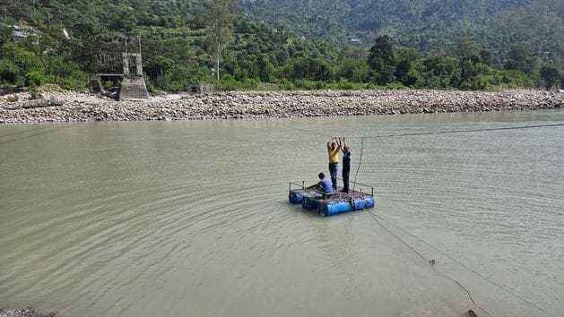 A footbridge failed to be built over the Beas River in Sprayi, so villagers built their own boats.