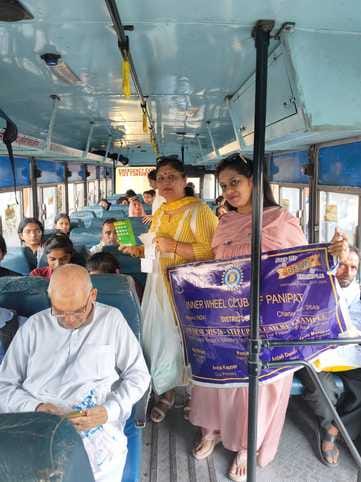 Distribute hygiene pouches to passengers