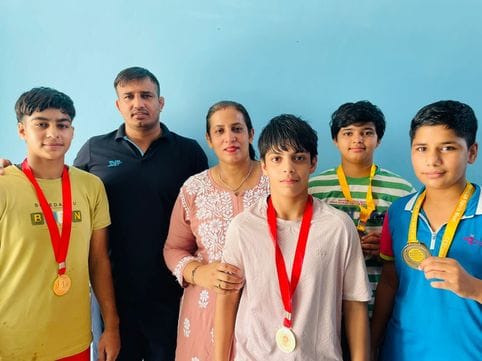Daughters won three gold and one silver medals in the state level wrestling competition.