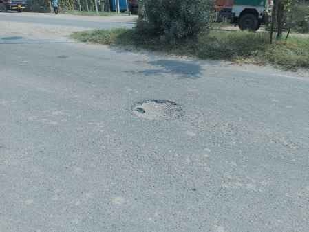 Deep potholes on Sector-25 road become a problem