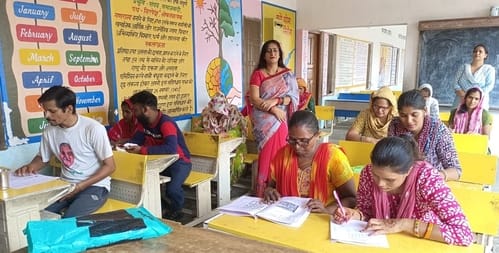 Her family didn't send her to school as a child, but now her daughter has shown her the path to education.