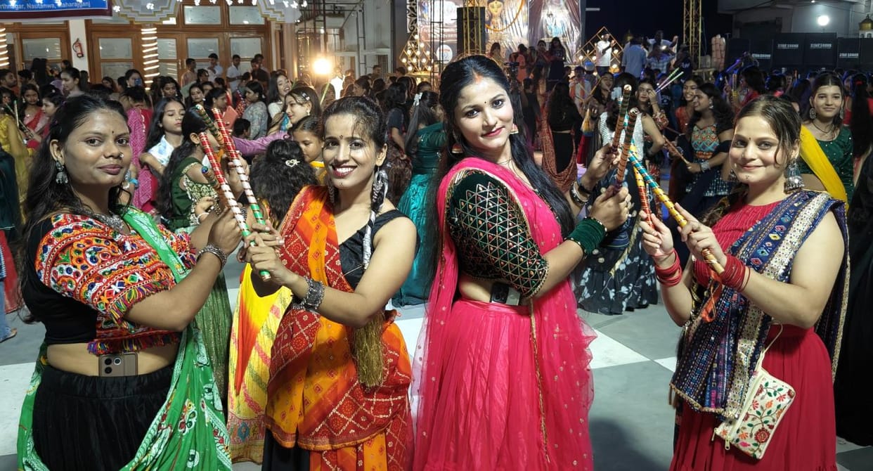 Young women danced late into the night in traditional attire at Dandiya Night.