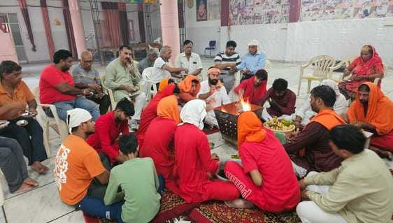 Youths wearing Hanuman's crown performed havan