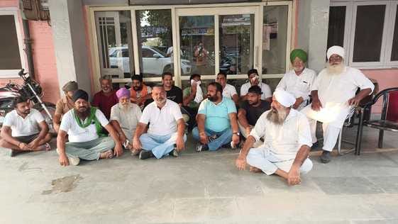 Angry farmers staged a sit-in protest over the non-purchase and lifting of paddy.