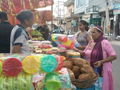 Women gathered to buy fruits and puja materials.Women gathered to buy fruits and puja materials.