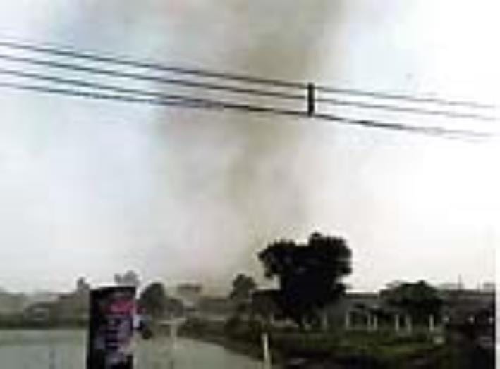 A cloud of garbage enveloped the village, walls collapsed and tin roofs flew away.