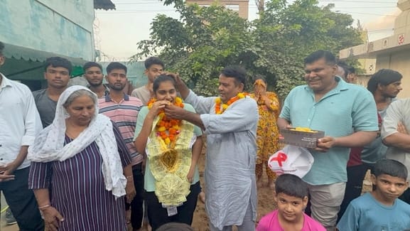 Gold medalist Aditi was welcomed