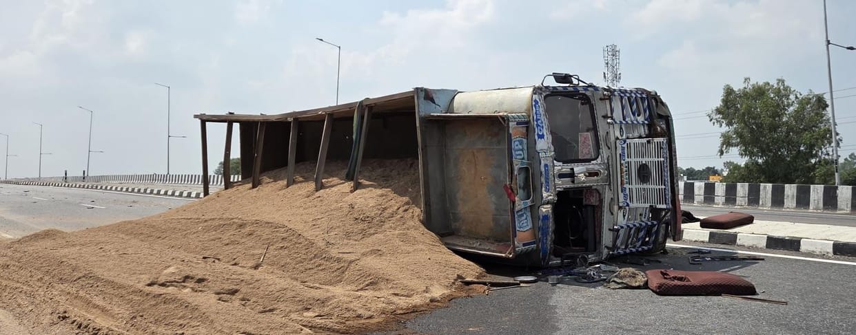 truck overturns, driver and operator injured