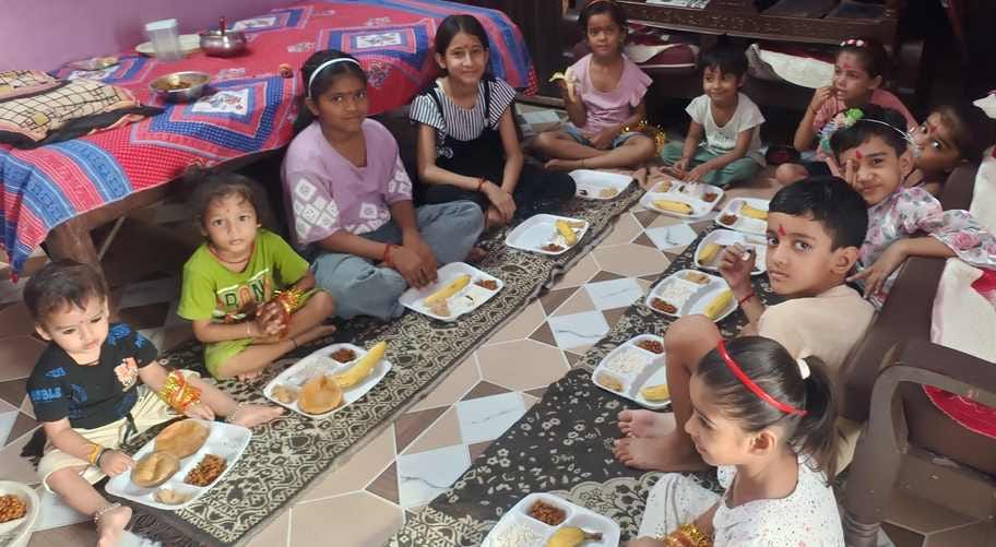 The fast was broken by feeding Prasad to the girls.