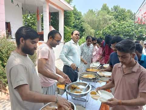Organizing a feast at the Shiva Durga temple in the Agricultural University.