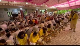 Devotees gathered at the news of Saint Premananda's arrival in the village.