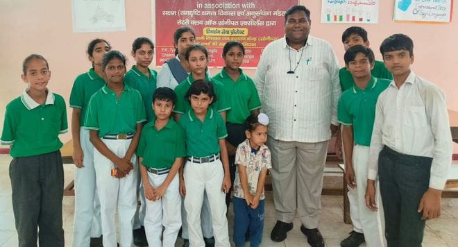 Food and educational materials were distributed to deaf and dumb children.