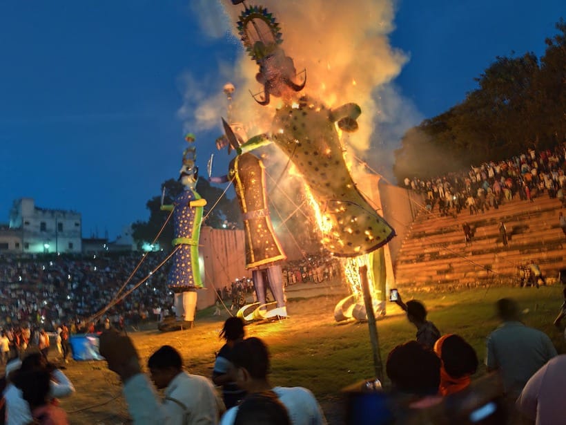 The burning of a 65-foot-tall effigy attracted a large crowd.
