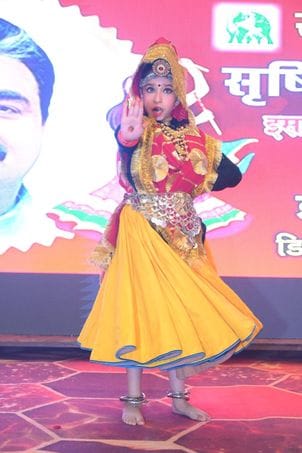Participants dressed in colorful costumes played Dandiya.