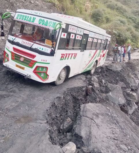 Bus hangs in the air after road caves in, 35 passengers have a narrow escape