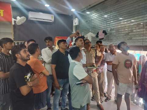 Masked men entered a clothing showroom in Majra village and stole goods in sacks