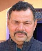 A liquor salesman died after being electrocuted while putting up a banner