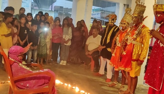 Women gazed intently at Sita, seated in a circle of fire.