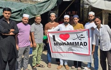 Photo of holding I Love Mohammad banner goes viral