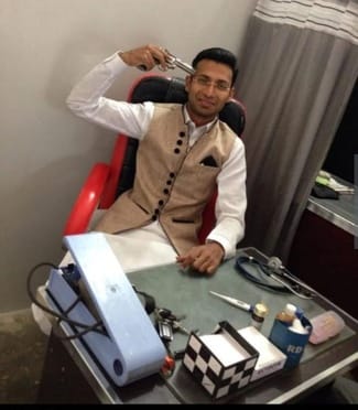 Photo of doctor holding illegal weapon at clinic goes viral, case filed
