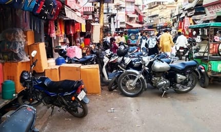 Park your bike inside the white line, if found outside the line the police will issue a challan.