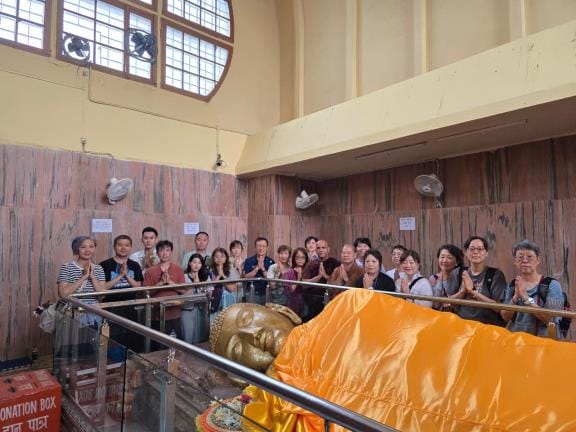 Taiwanese tourists bow to Buddha statue