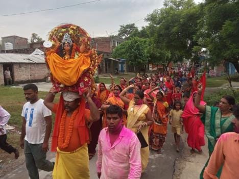 The idol was carried on the head and immersed with devotion.