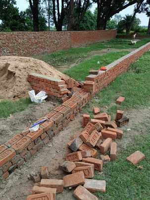 Bullies demolished a wall under construction, creating tension between the two sides.